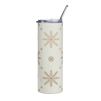 Cream tumbler with gold snowflake pattern and metal straw.