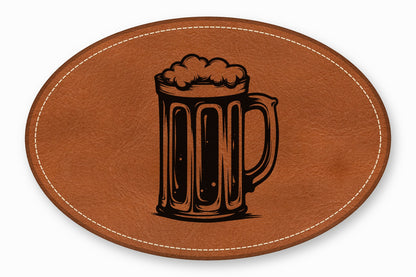 Brown oval leather patch featuring a black etched illustration of a frothy beer mug.