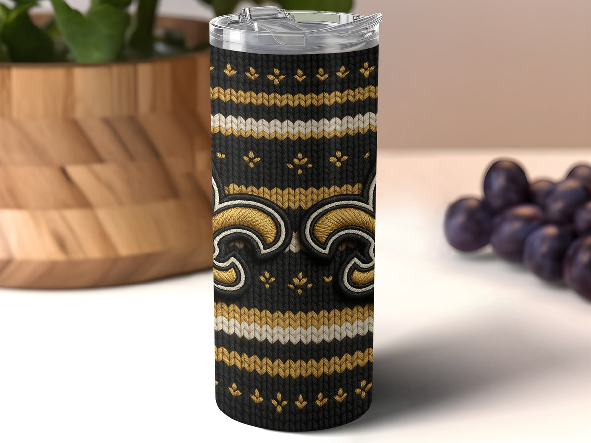 Black tumbler with gold and white fleur-de-lis and knit pattern.