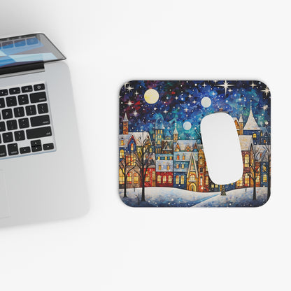 Mousepad with festive winter village scene under a starry night sky.