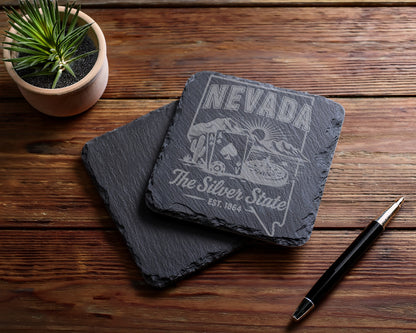 Engraved slate coaster with Nevada "The Silver State" design, cactus, mountains, and cards.