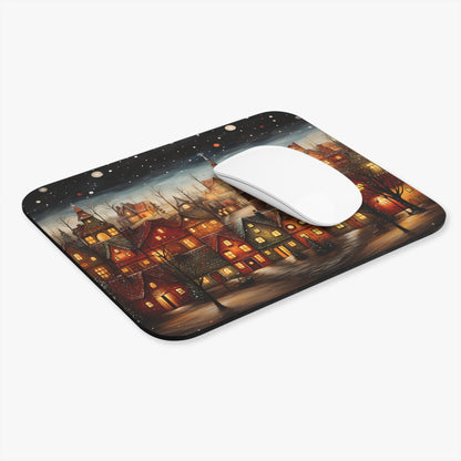 Mousepad featuring a snowy, nighttime village scene with lit windows and bare trees.