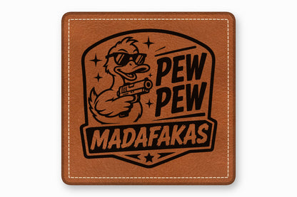 Brown leather patch with rounded corners, white stitching, and a black laser-engraved duck holding a gun.