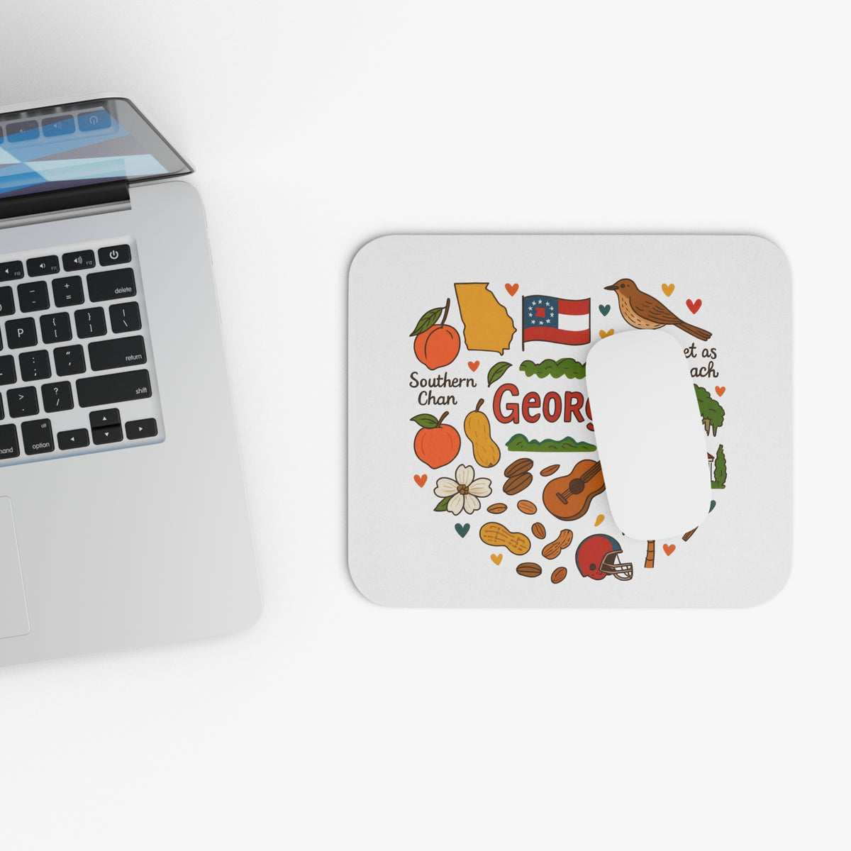 Mousepad with Georgia state symbols, including peaches, peanuts, and a bird.