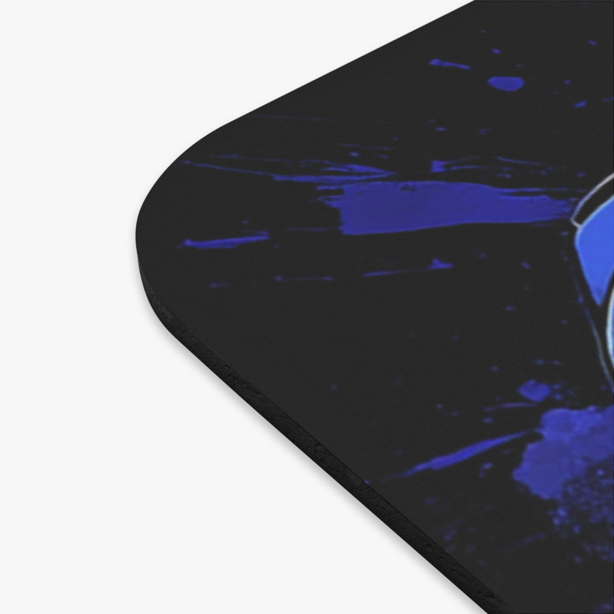 Black mousepad with blue abstract paint splatters and a partially visible logo.