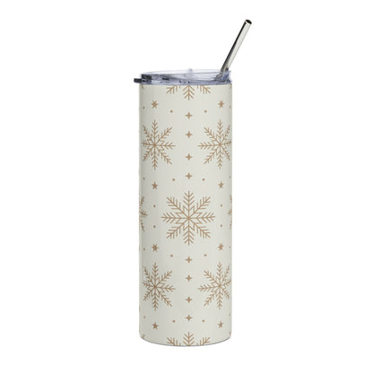 Cream tumbler with gold snowflake pattern and silver straw.