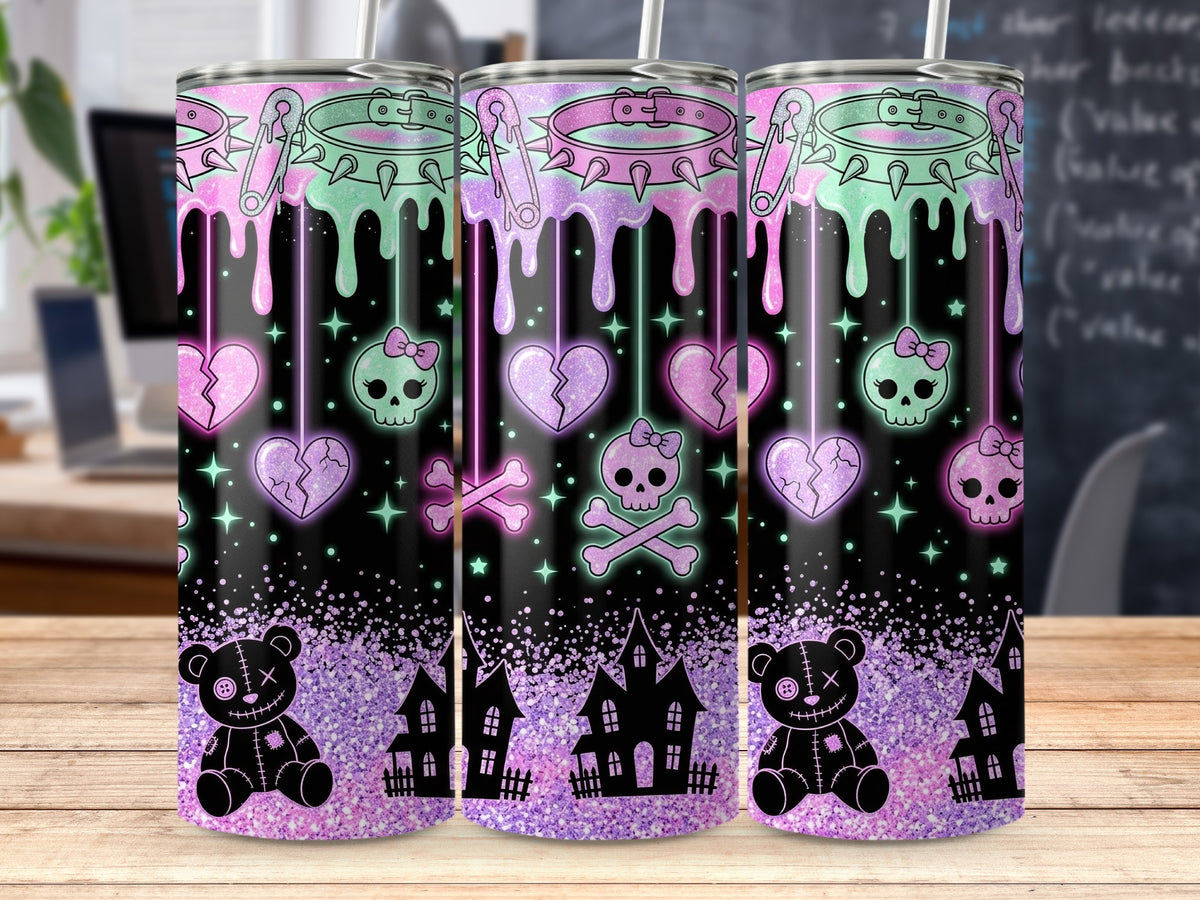 Goth-inspired tumbler with dripping pink and mint collars, skulls, broken hearts, and spooky houses.