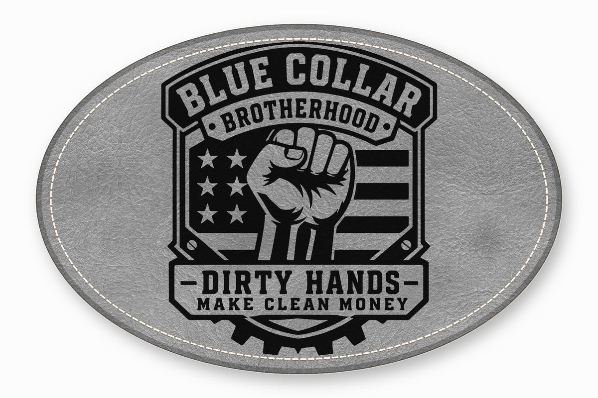 An oval gray leather patch featuring a black graphic with a raised fist, American flag, and text reading Blue Collar Brotherhood and Dirty Hands Make Clean Money.