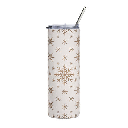 White tumbler with brown snowflake pattern and silver straw.