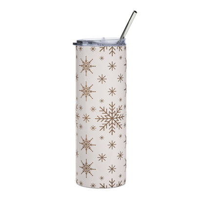 White tumbler with brown snowflake pattern and metal straw