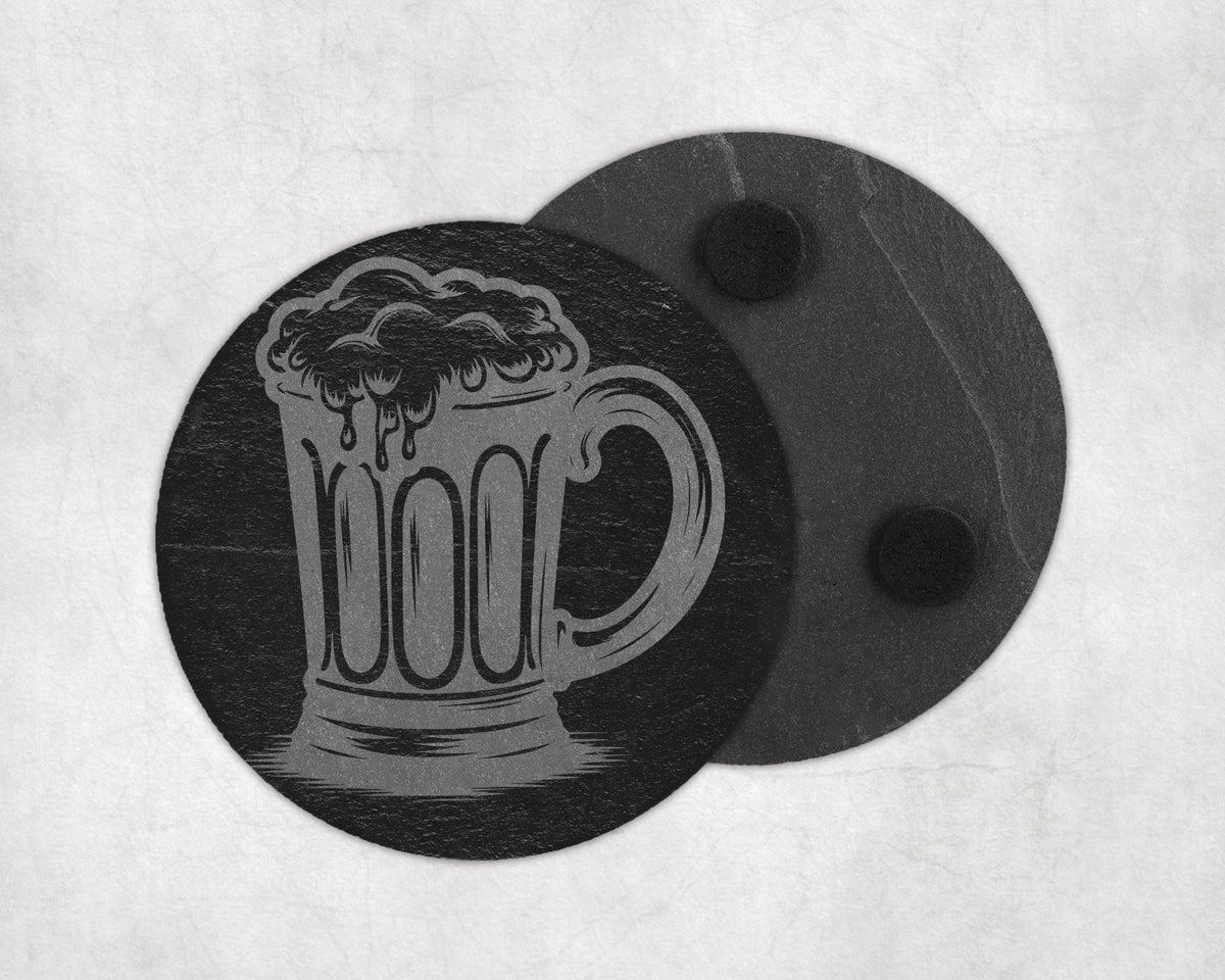 Slate coaster engraved with a beer mug and foam, with a second coaster behind.