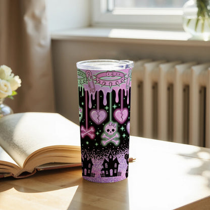 Tumbler with pastel gothic designs of skulls, broken hearts, haunted houses, and spikes.