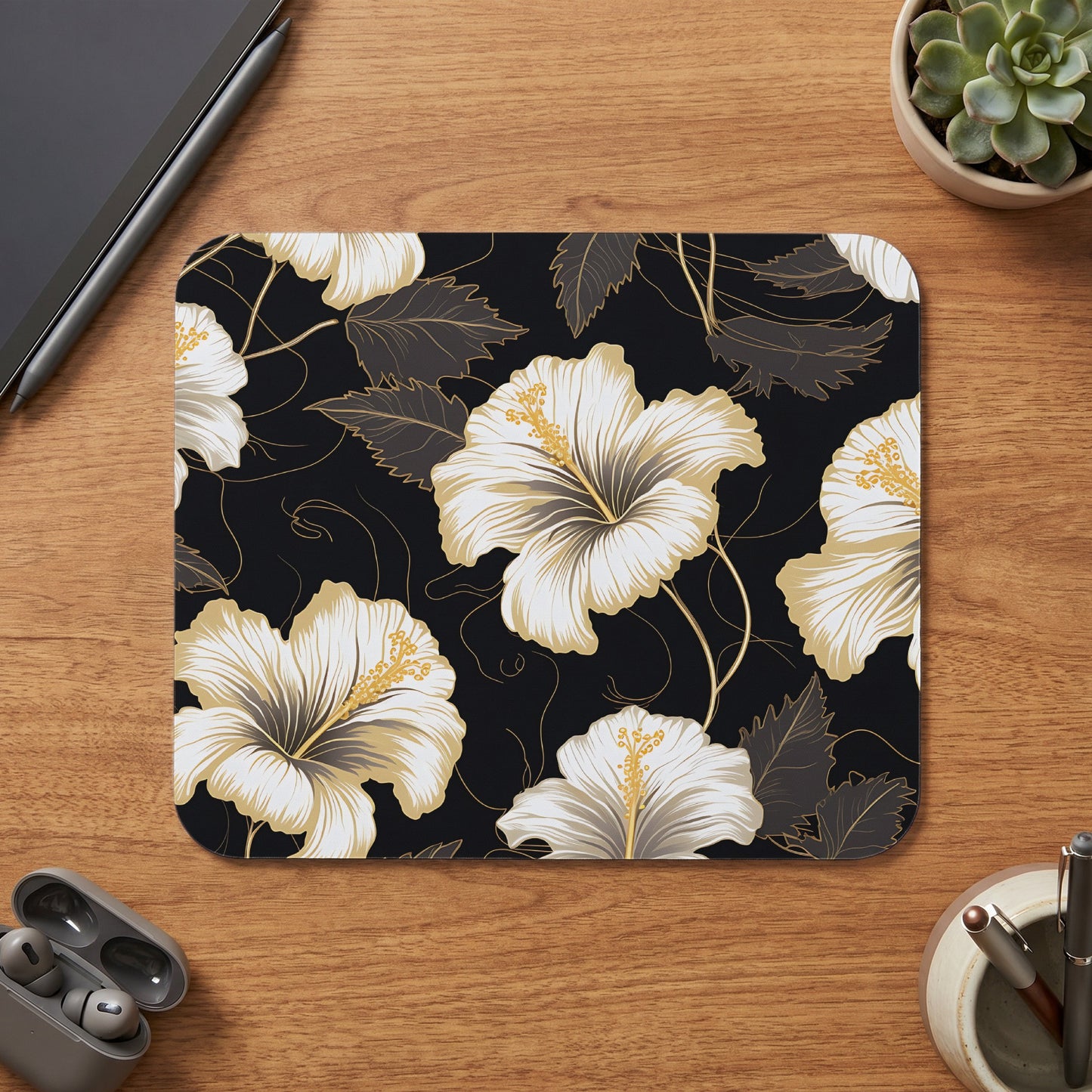 Black mousepad with white and gold hibiscus floral pattern.