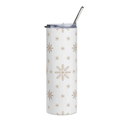 White tumbler with gold snowflake pattern and a metal straw.