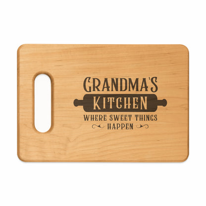 Wooden cutting board with "Grandma's Kitchen" and rolling pin engraving.