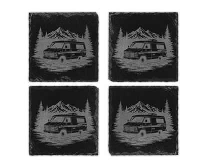 Four slate coasters engraved with a vintage camper van in a forest scene.