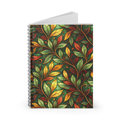 Spiral bound notebook with a green, gold, and red leaf pattern.