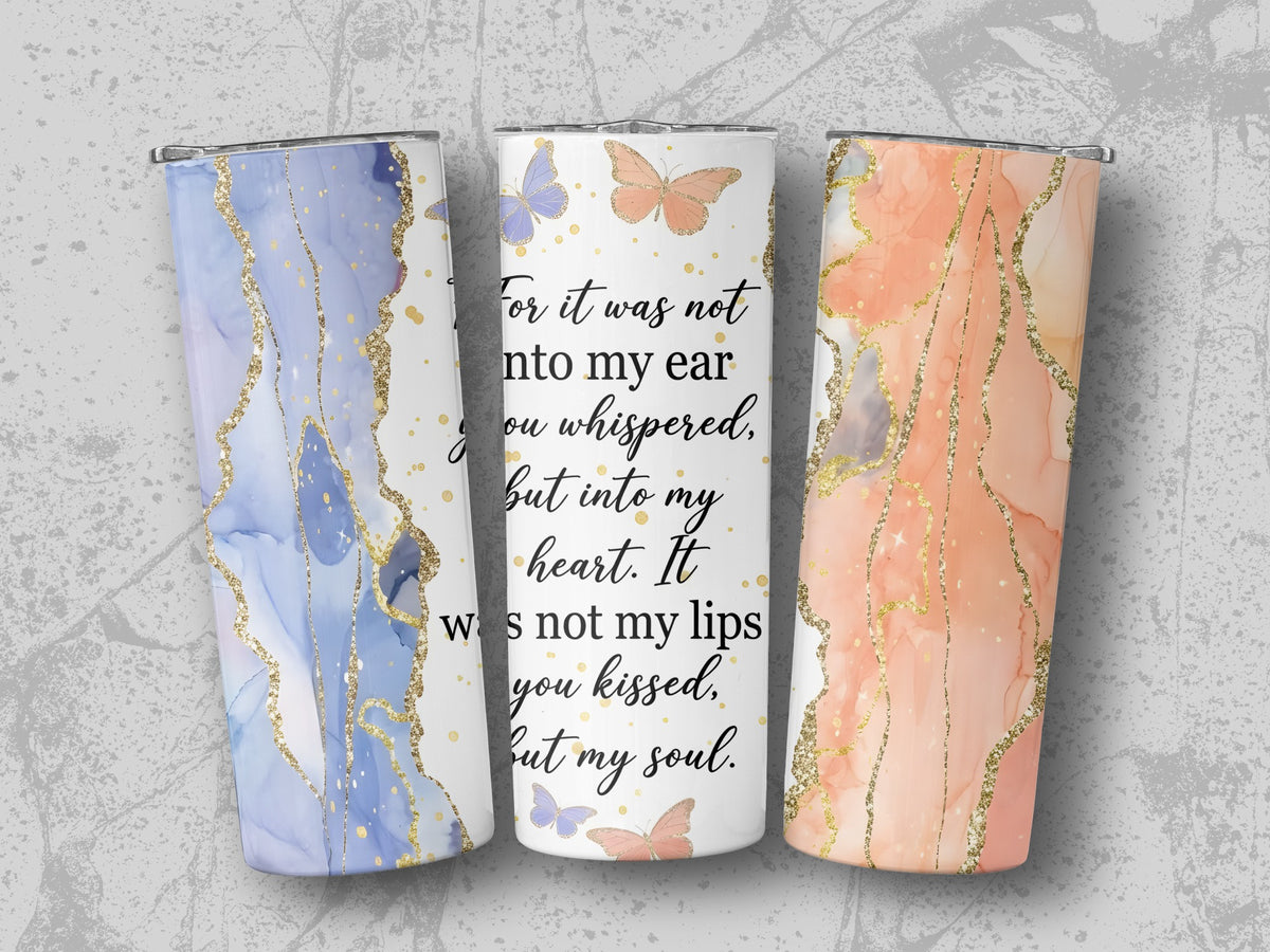 Three tumblers with marbled blue, white, and orange designs, featuring gold accents and butterflies.