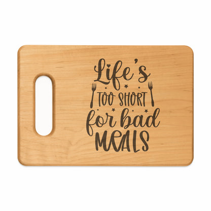 Wooden cutting board with engraved text "Life's too short for bad MEALS."