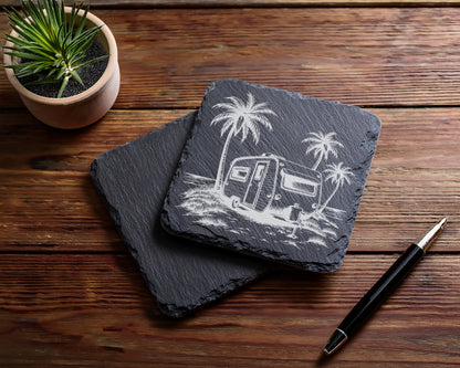 Two slate coasters, one with a vintage camper and palm trees design.