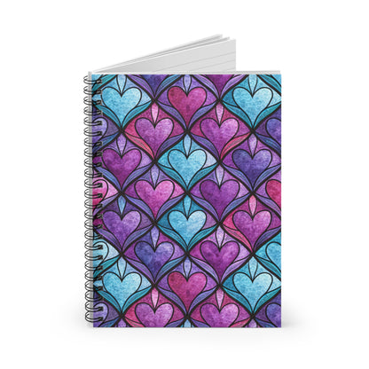 Spiral-bound notebook with a stained-glass heart pattern in purple, pink, and blue.