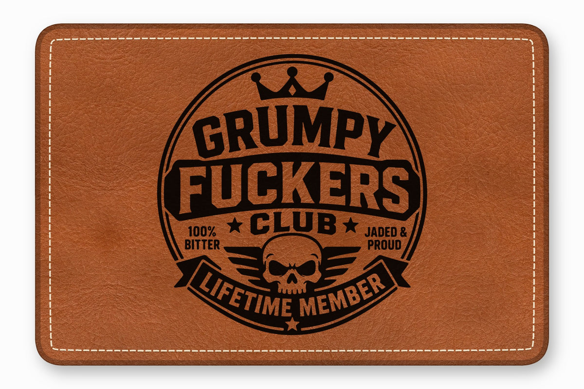 Tan leather rectangular patch with white stitched borders and a black branded skull emblem.