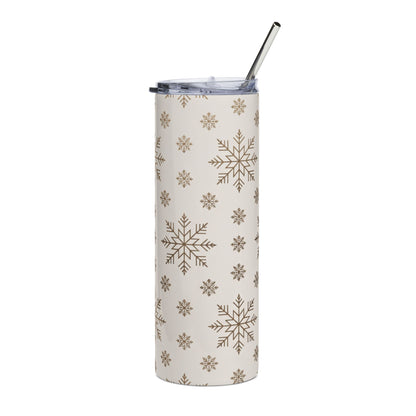 Cream tumbler with brown snowflake pattern and metal straw.