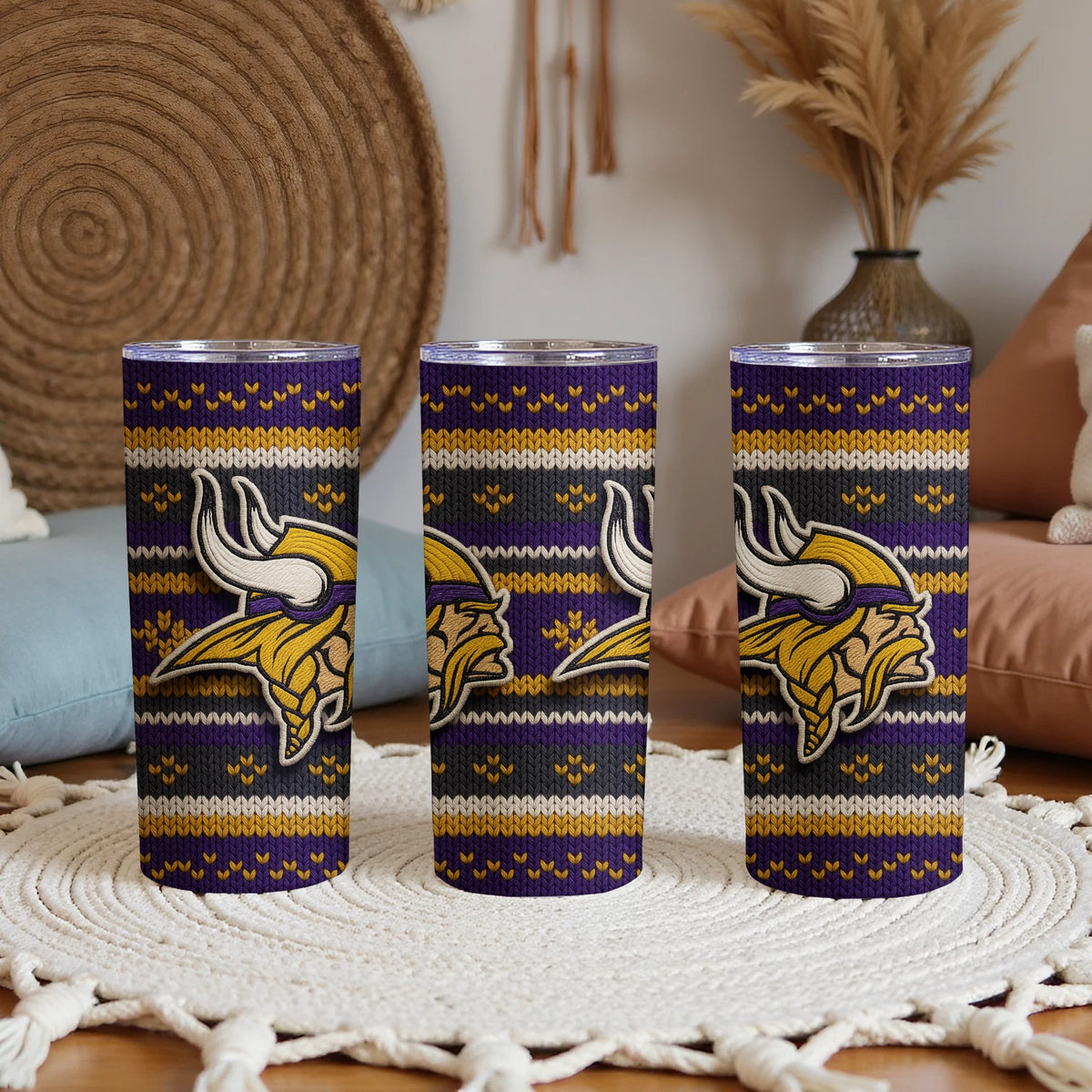 Three tumblers with a purple, gray, and yellow knit pattern and the Minnesota Vikings logo.