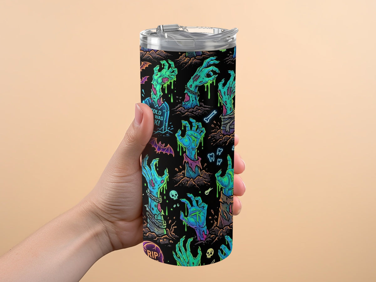 Tumbler with a black background and a neon zombie hand pattern.