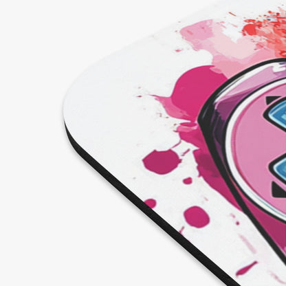 Pink and red watercolor splatters on a white mousepad with a stylized pink and blue heart design.