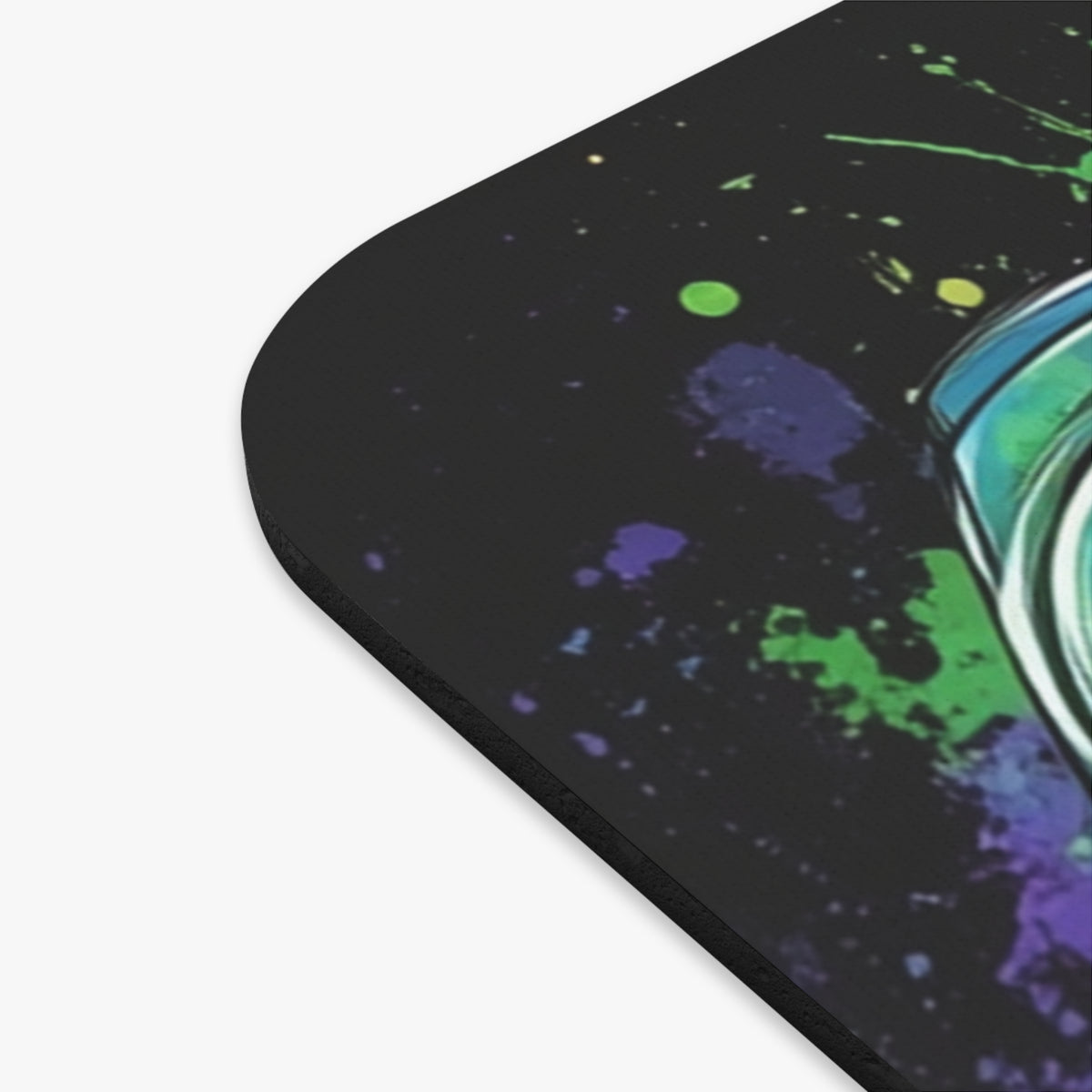 Mousepad with a black background and a watercolor paint splatter design.
