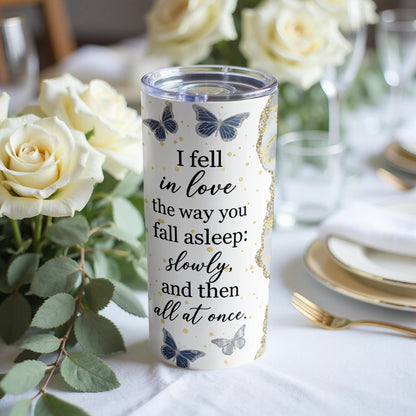 White tumbler with butterflies and quote "I fell in love the way you fall asleep: slowly, and then all at once."
