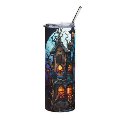 Tumbler with a spooky haunted house and moon graphic, featuring a silver straw.