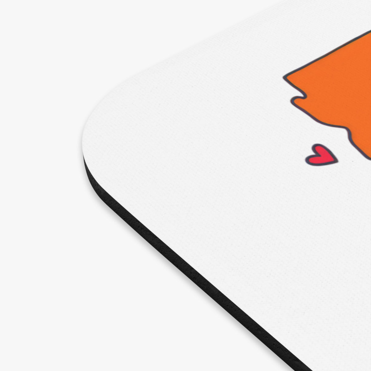 White mousepad with orange outline of a state and a red heart.