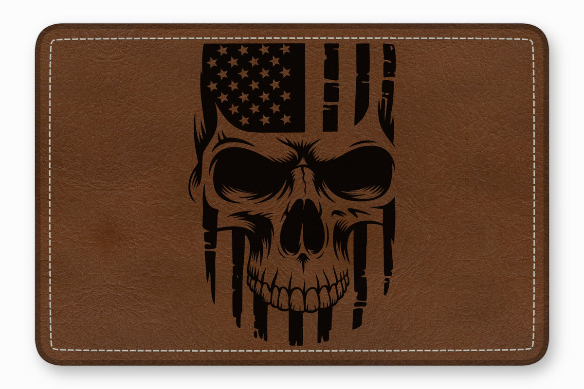 Brown leather patch with rounded corners and white stitching, featuring a black laser-engraved American flag skull design.