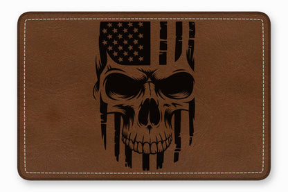 Brown leather patch with rounded corners and white stitching, featuring a black laser-engraved American flag skull design.