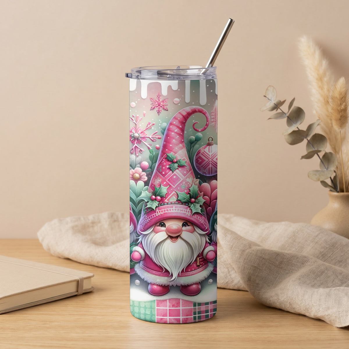 Tumbler with pink gnome, snowflakes, and Christmas ornaments.