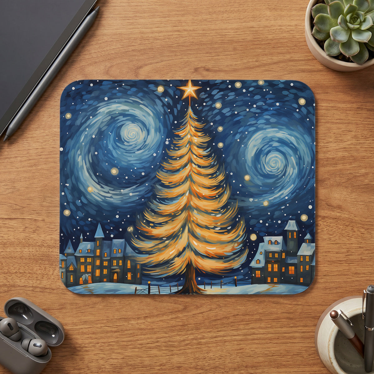 Mousepad with a starry night Christmas scene featuring a glowing tree and village.