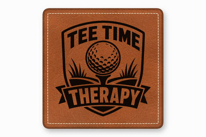 Brown leather patch with rounded corners featuring a black engraved golf emblem and text reading TEE TIME THERAPY.