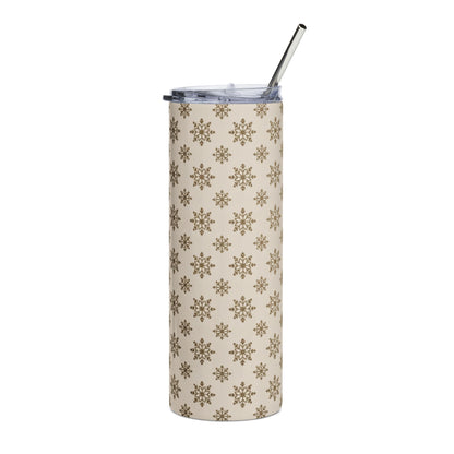 Tan tumbler with repeating gold snowflake pattern and silver straw.