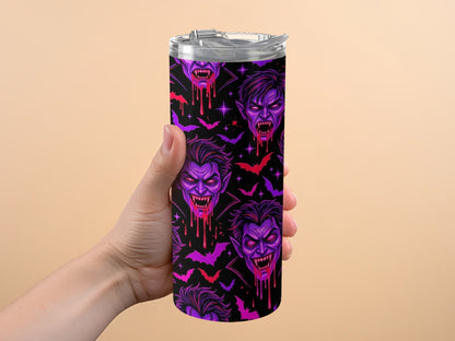 Tumbler with a black background featuring purple vampire faces and bats.