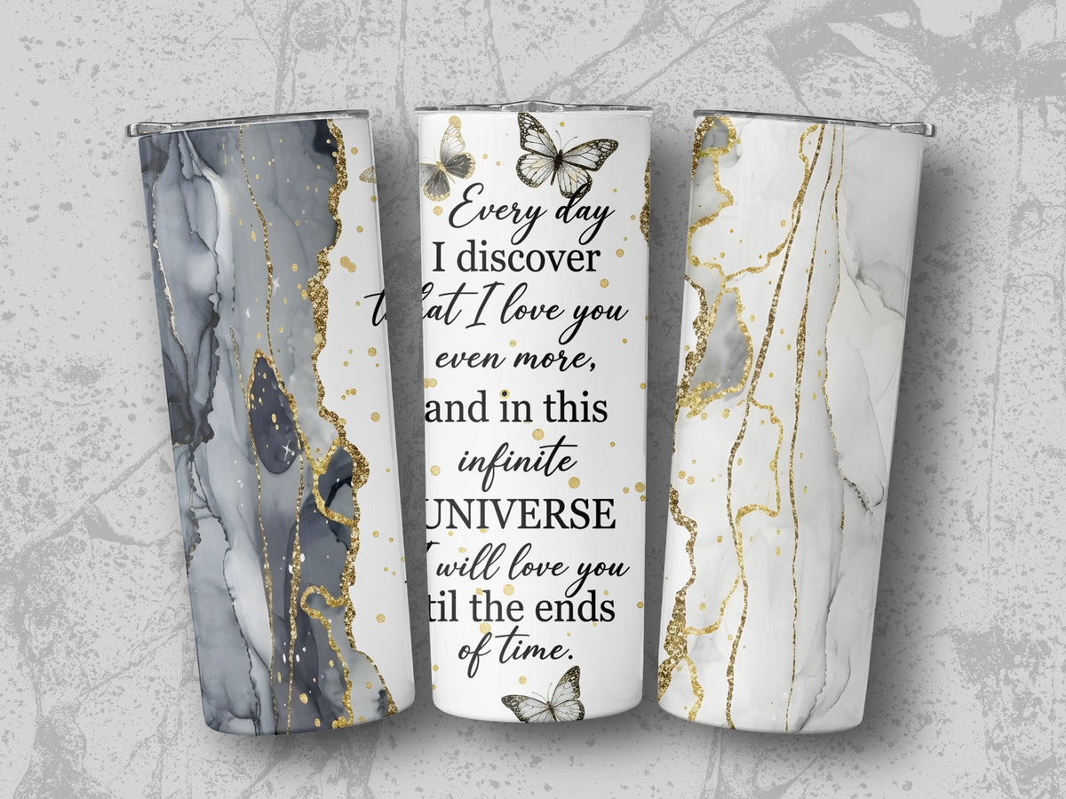 Three tumblers with marble and gold accents, one with text about love.
