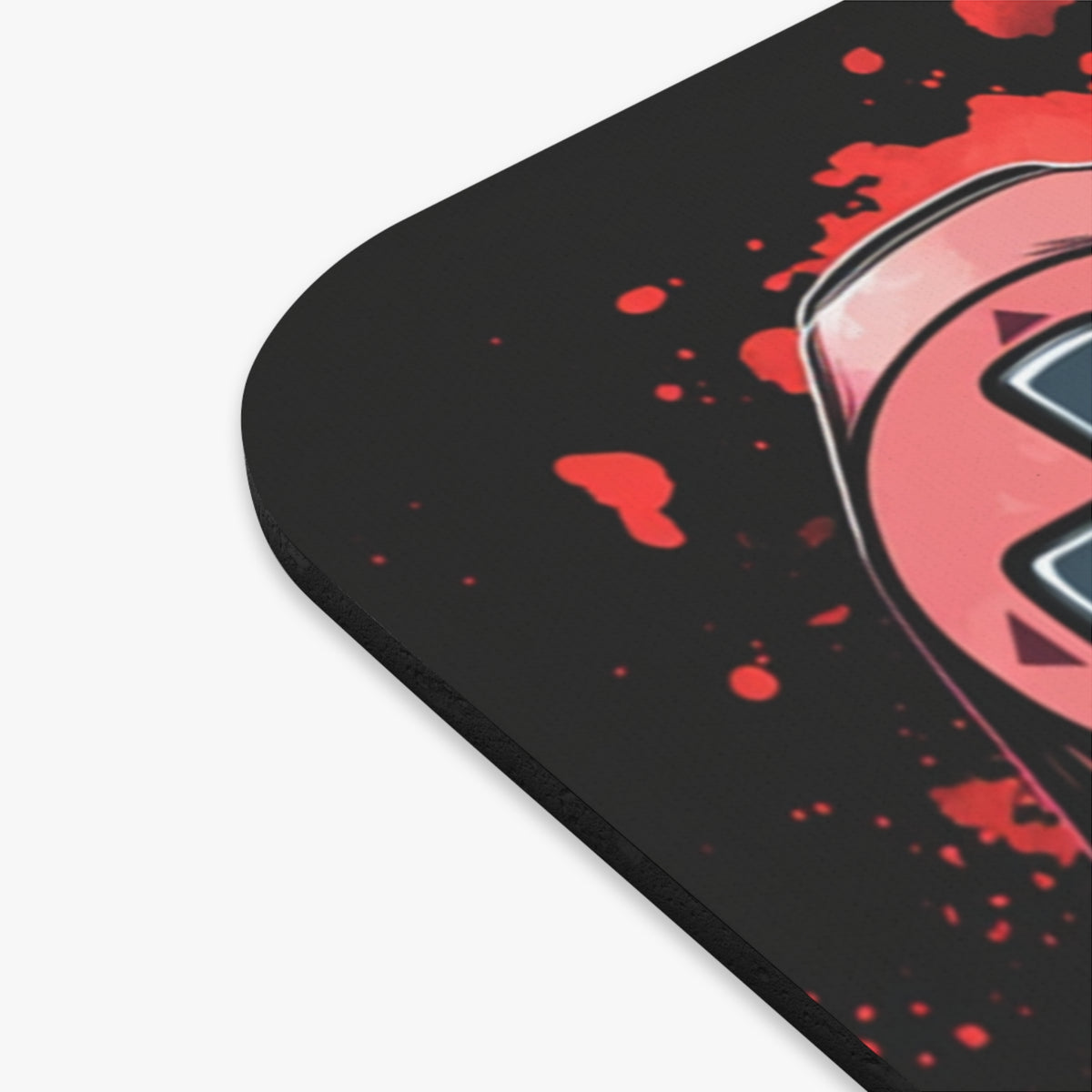 Mousepad with black background and red splatter design, featuring a pink and blue graphic.