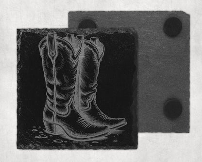 Slate coaster with engraved cowboy boot design, and another coaster behind.