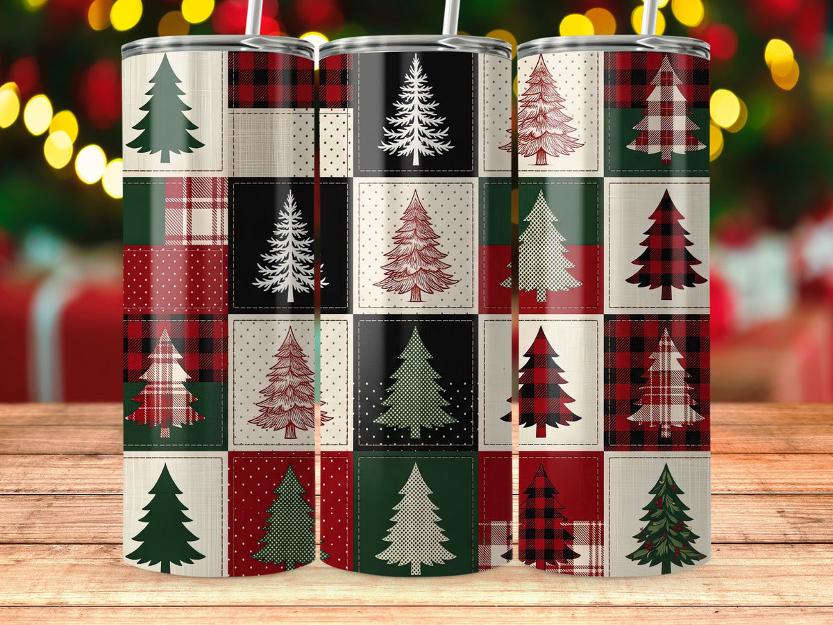 Three tumblers with a patchwork Christmas tree design on a wooden surface.