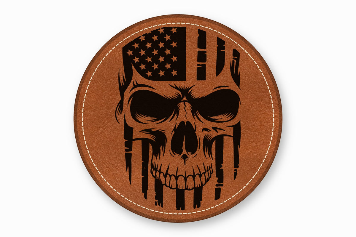 Round brown leather patch with white stitched border featuring a black skull and American flag design.