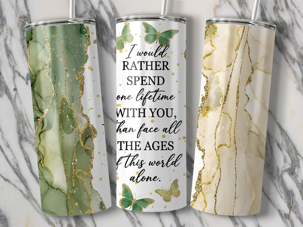 Three tumblers with marble and gold designs, one with quote.