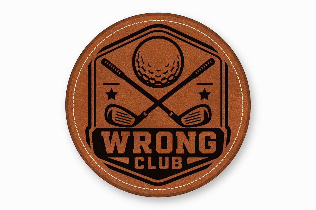 Round brown leather patch with white stitching featuring a black golf emblem and text that reads WRONG CLUB.