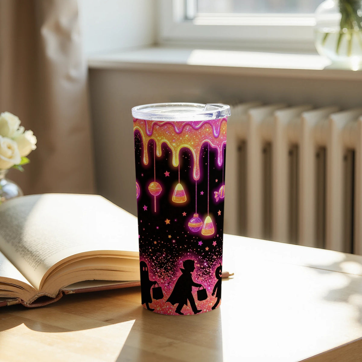 Halloween tumbler with dripping candy design and trick-or-treaters in silhouette.