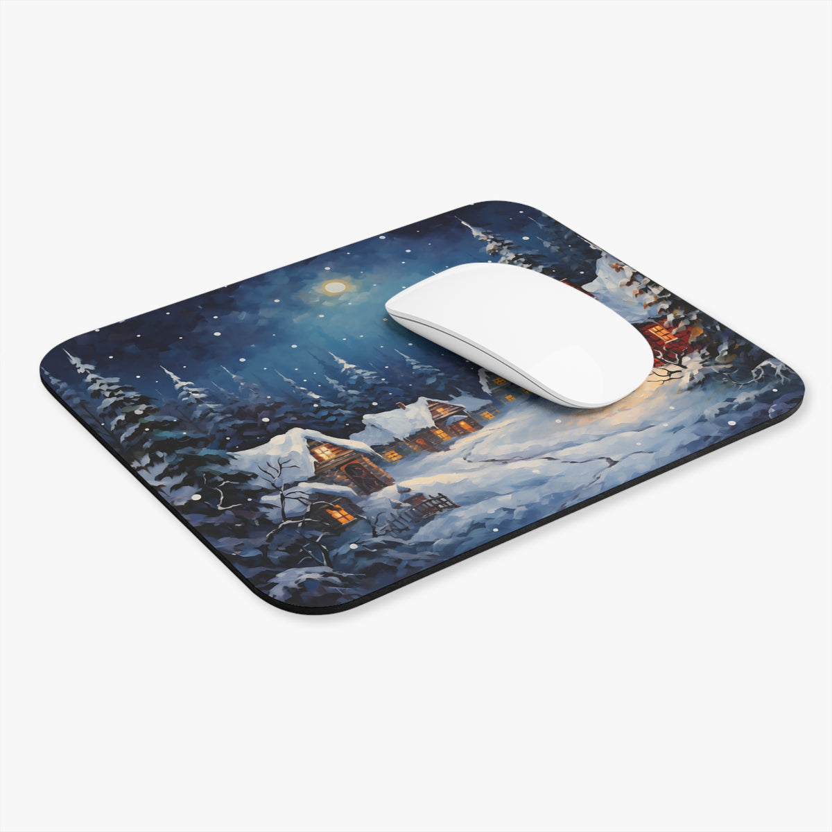 Mousepad with a snowy village scene under a moonlit night sky.